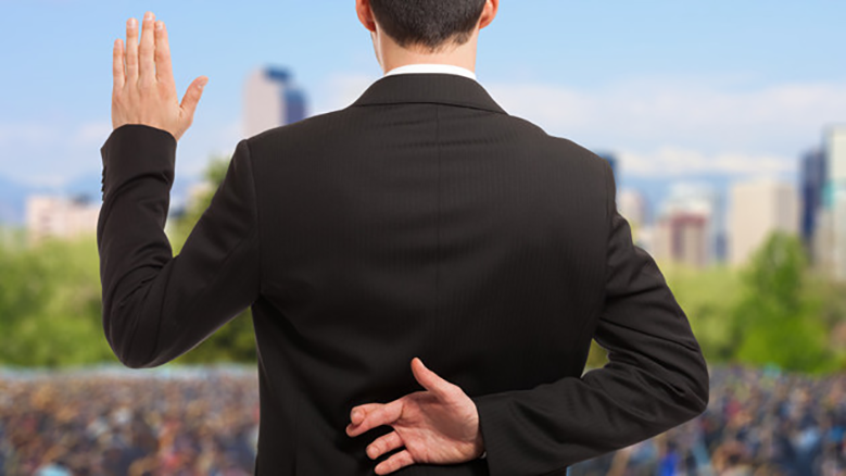 Picture of politician with left hand raised to tell the truth while right hand is behind his back with fingers crossed